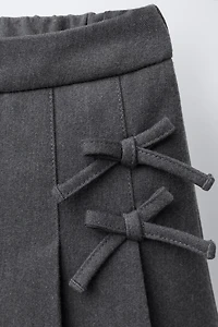 JUPE-SHORT PLIS PLATS LACETS