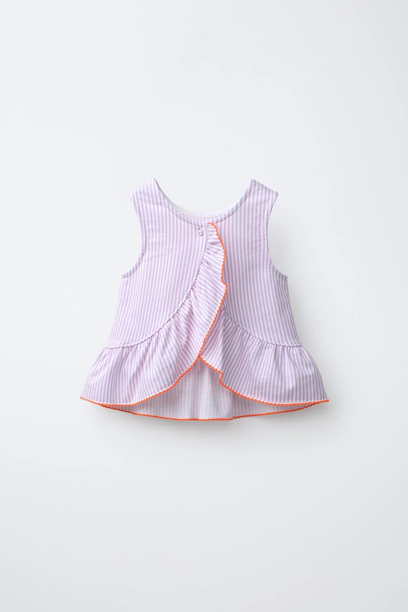 T-SHIRT À RAYURES AVEC PÉPLUM ET BIAIS EN CONTRASTE