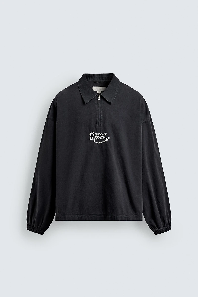 POLO À ZIP BRODÉ