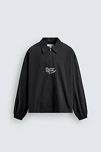 POLO À ZIP BRODÉ