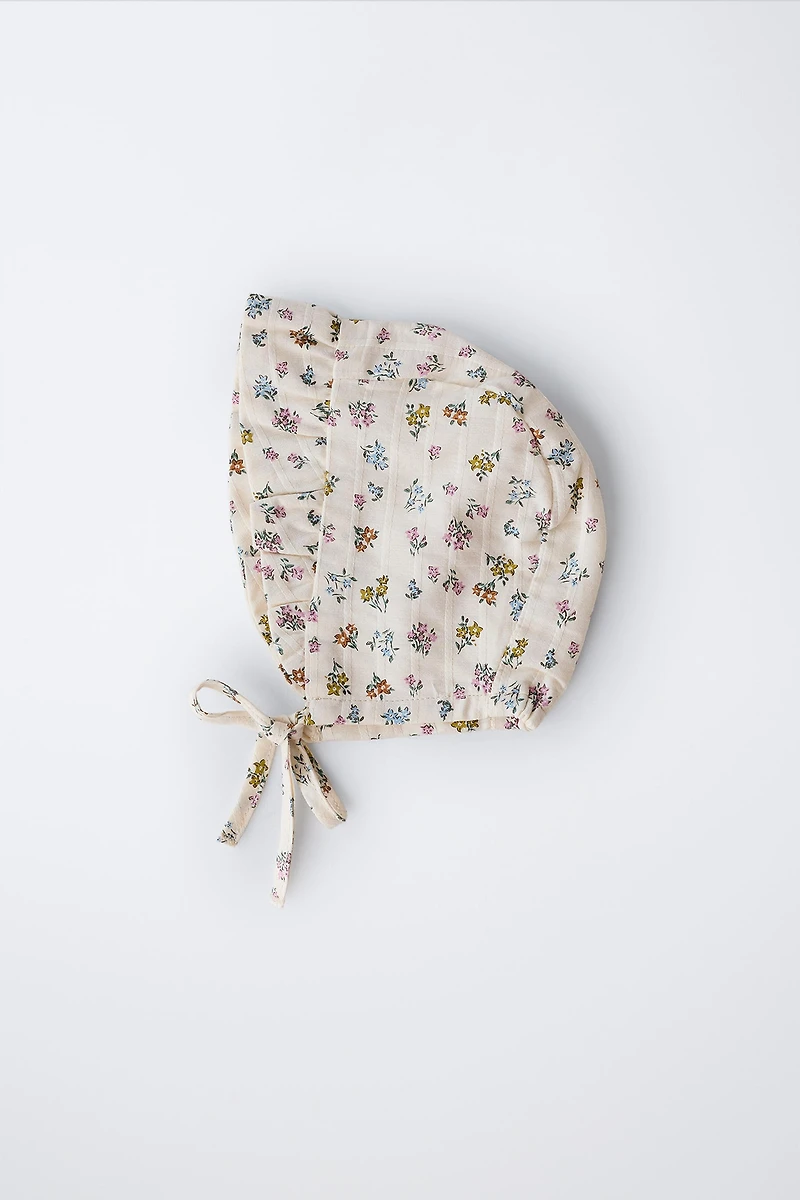 FLORAL TEXTURED RUFFLED BONNET
