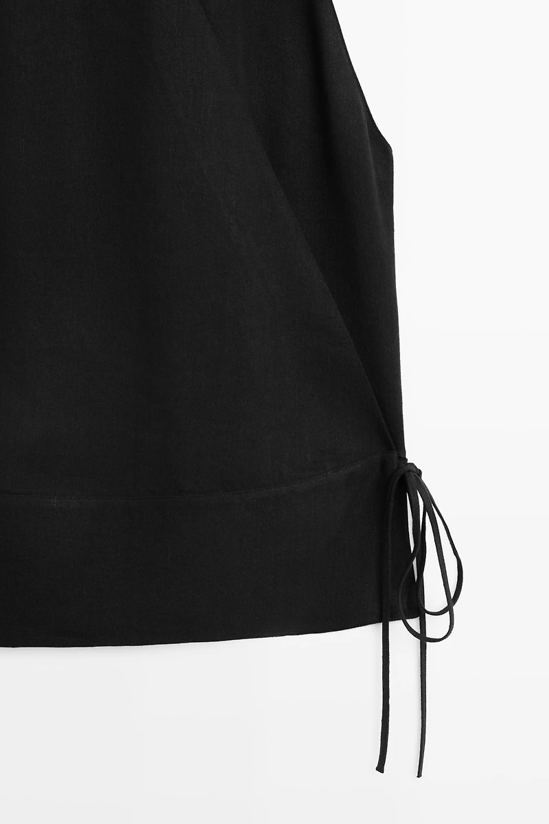 Draped surplice top with corset belt detail