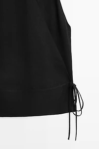 Draped surplice top with corset belt detail