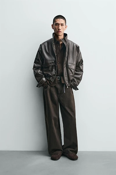 BLOUSON COURT MATIÈRE SYNTHÉTIQUE