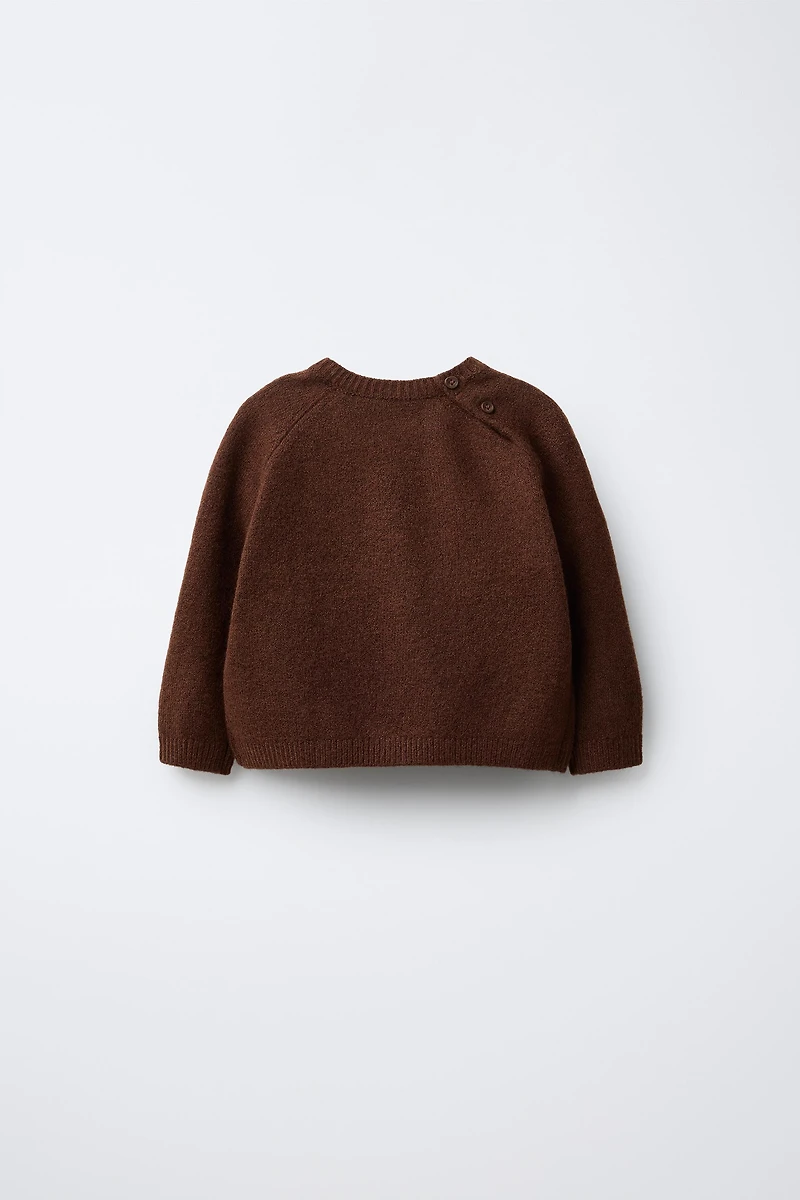 PULL EN MAILLE AVEC CANARD BRODÉ