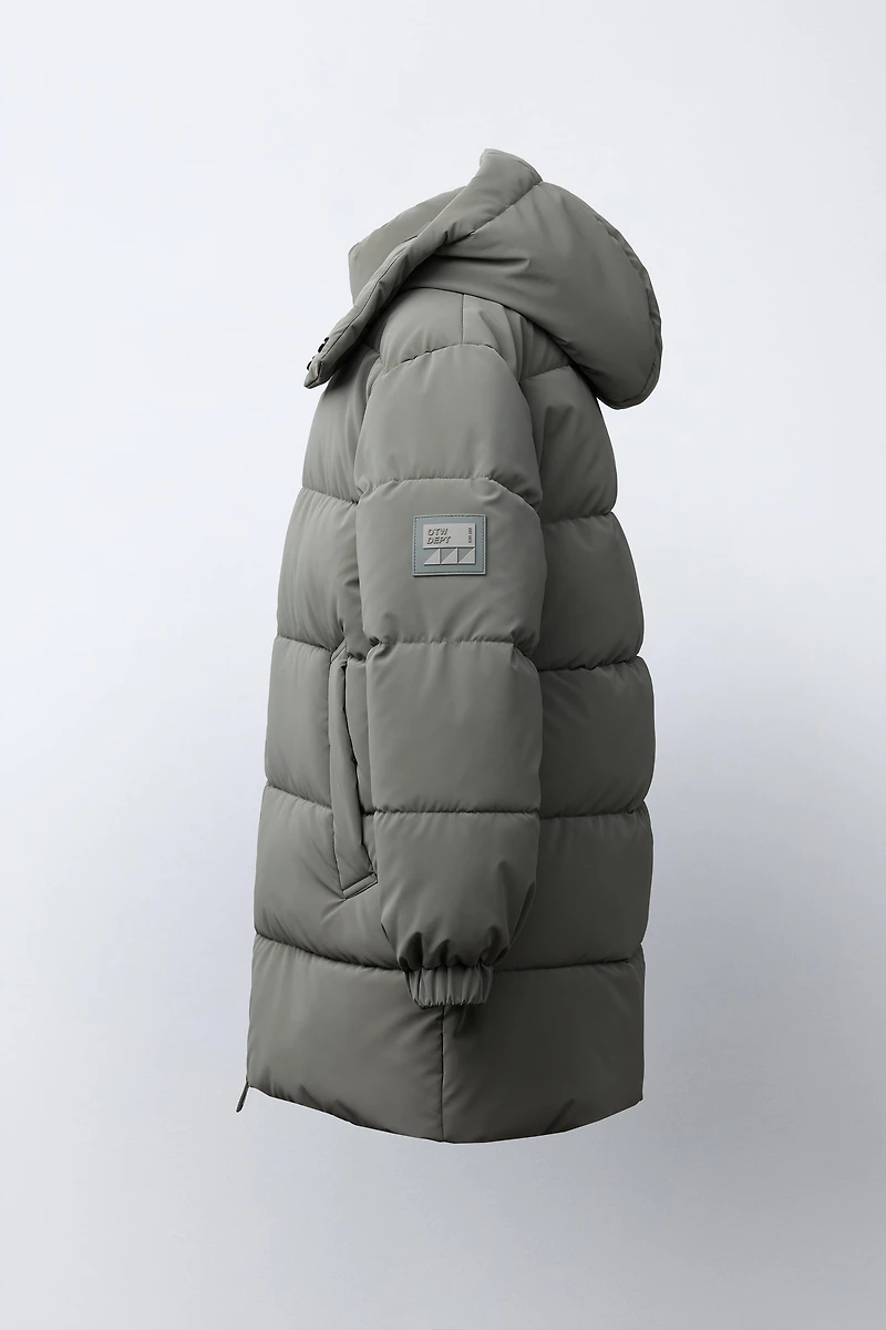 MANTEAU LONG À ÉTIQUETTE GOMMÉE