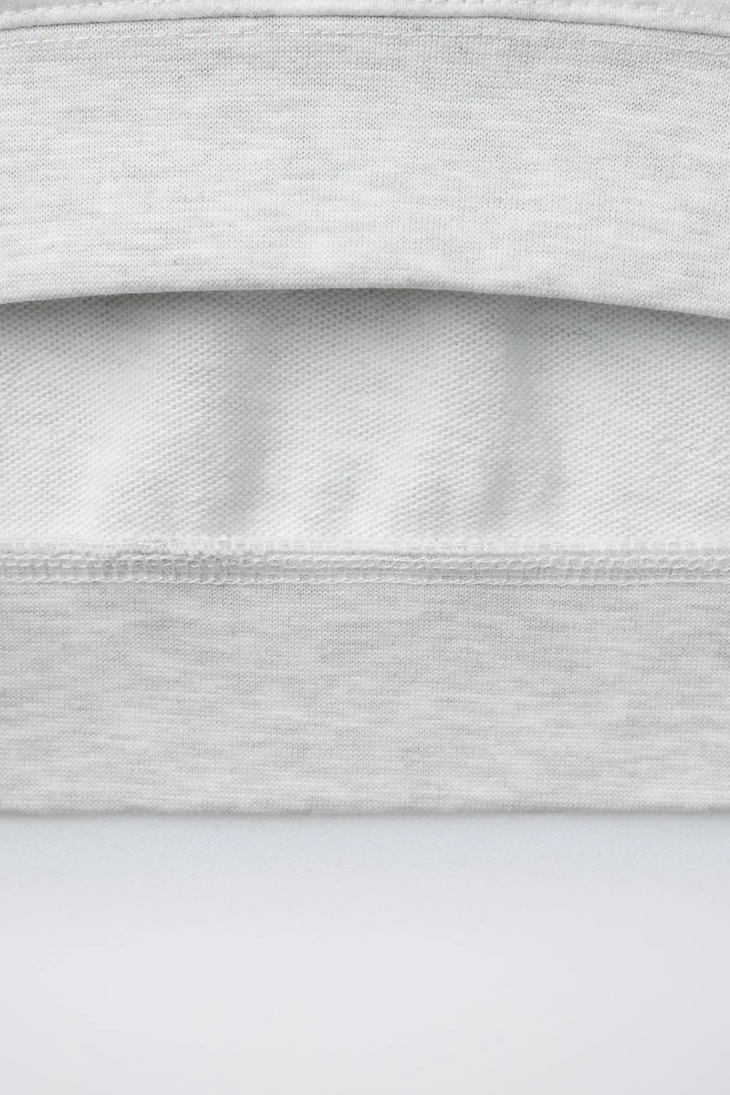 SWEAT MANCHES COURTES INSCRIPTION EN RELIEF