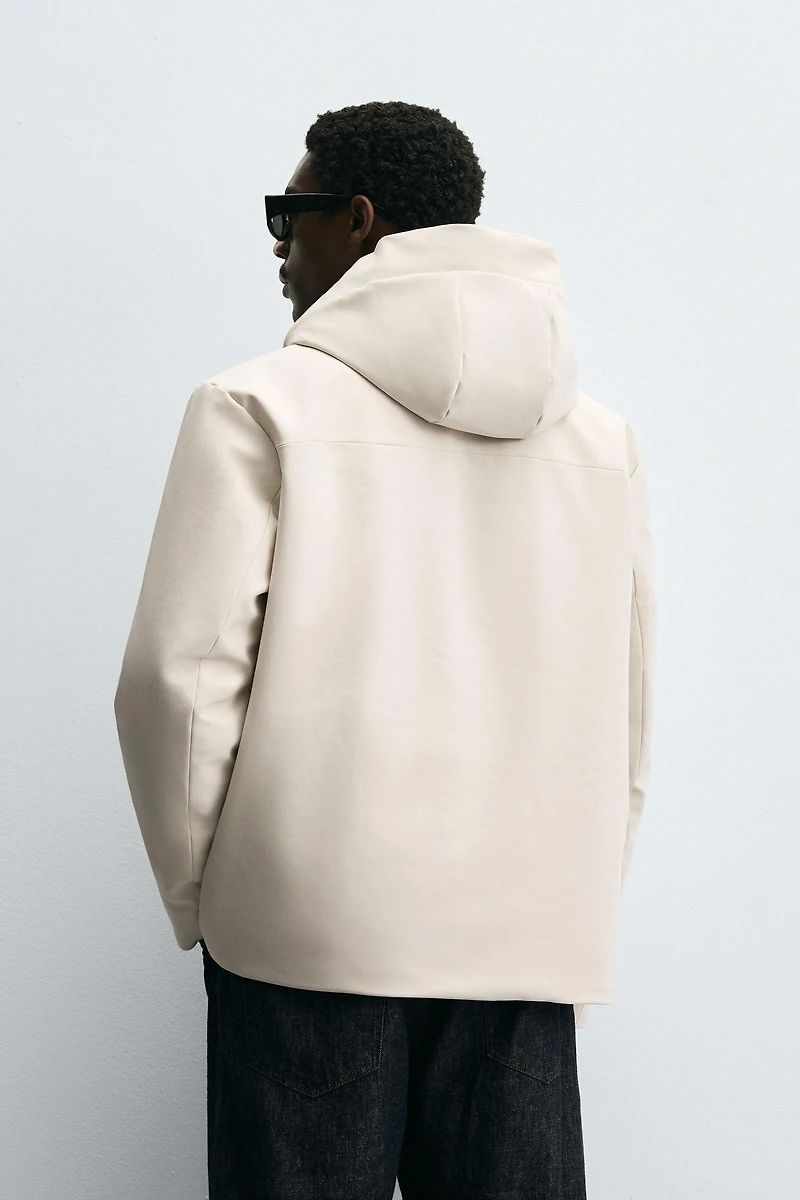VESTE TECHNIQUE À CAPUCHE