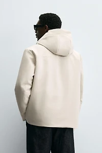 VESTE TECHNIQUE À CAPUCHE