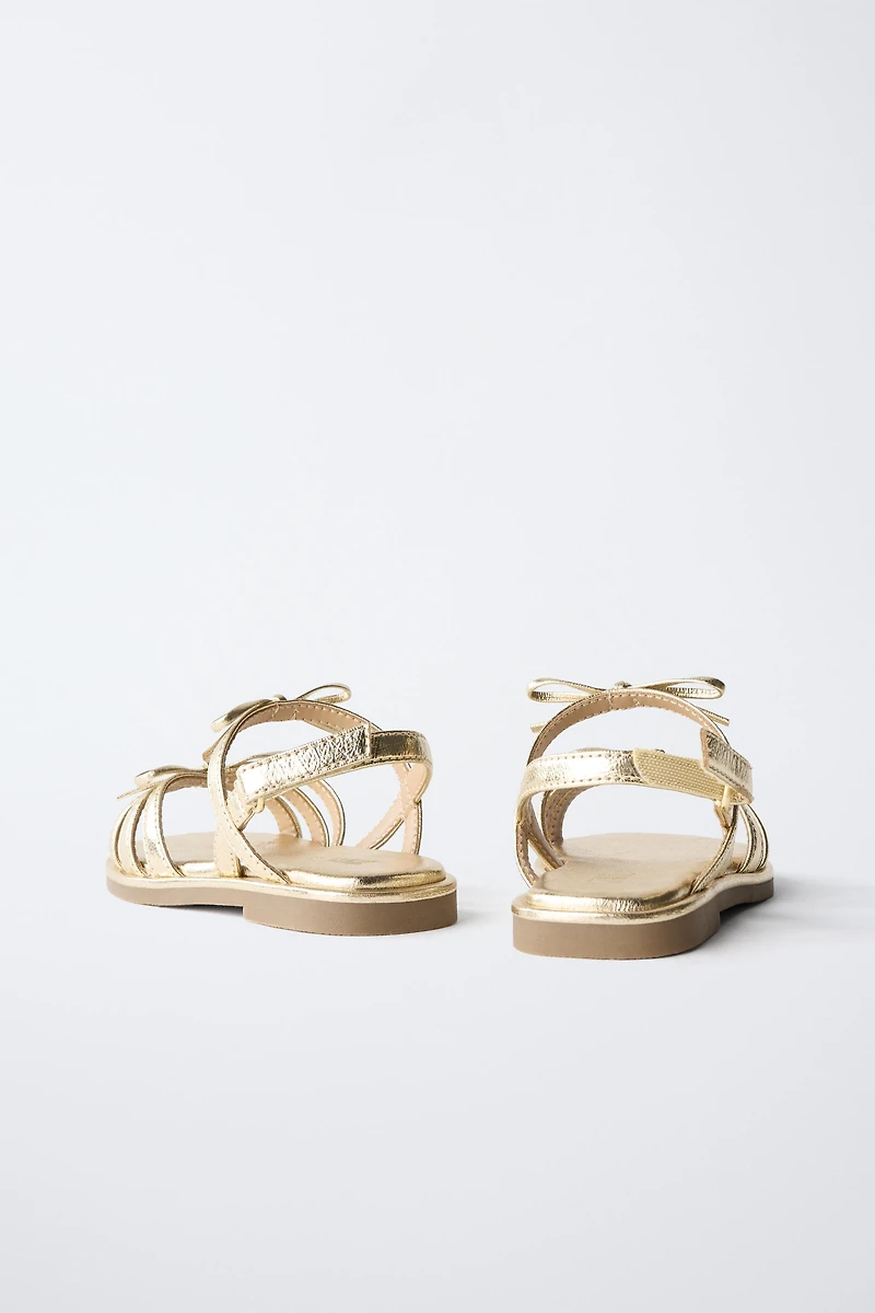 METALLIC BOW SANDALS