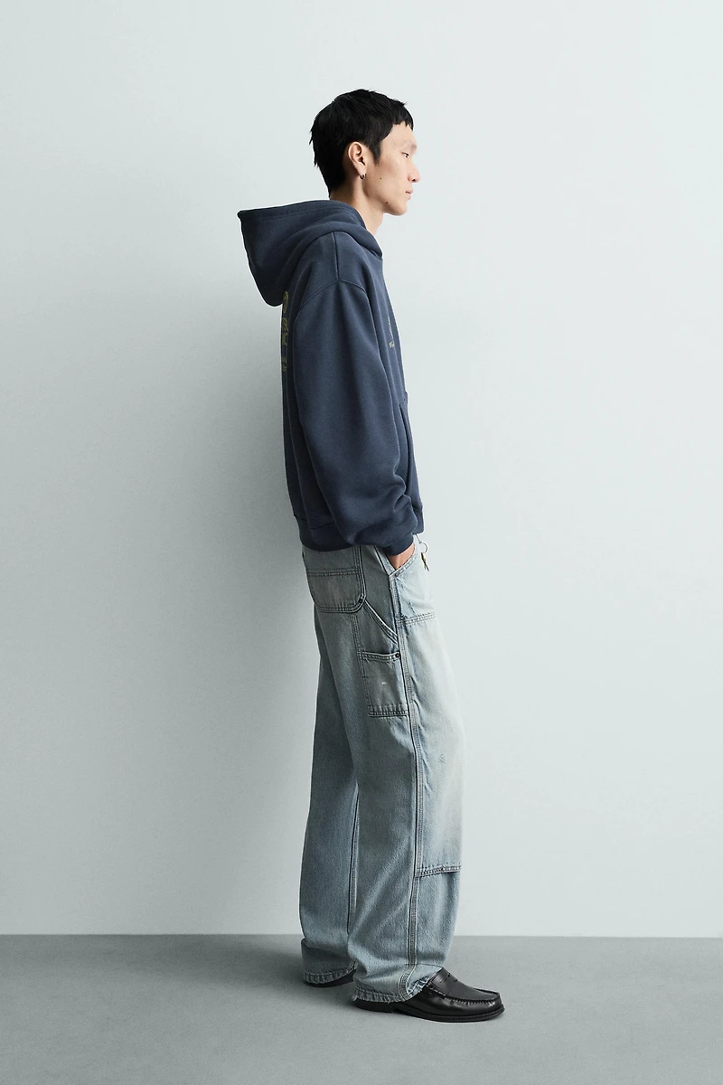 WASHED PRINTED TEXT SWEATSHIRT