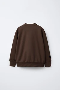 VARSITY INTERLOCK SWEATSHIRT