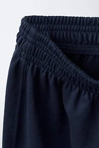 PANTALON INTERLOCK À JAMBES LARGES