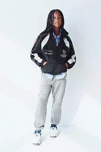 UEFA CHAMPIONS LEAGUE ® WATER REPELLENT JACKET WITH HOODIE