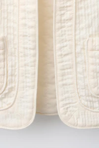 GILET STRUCTURÉ À VOLANTS