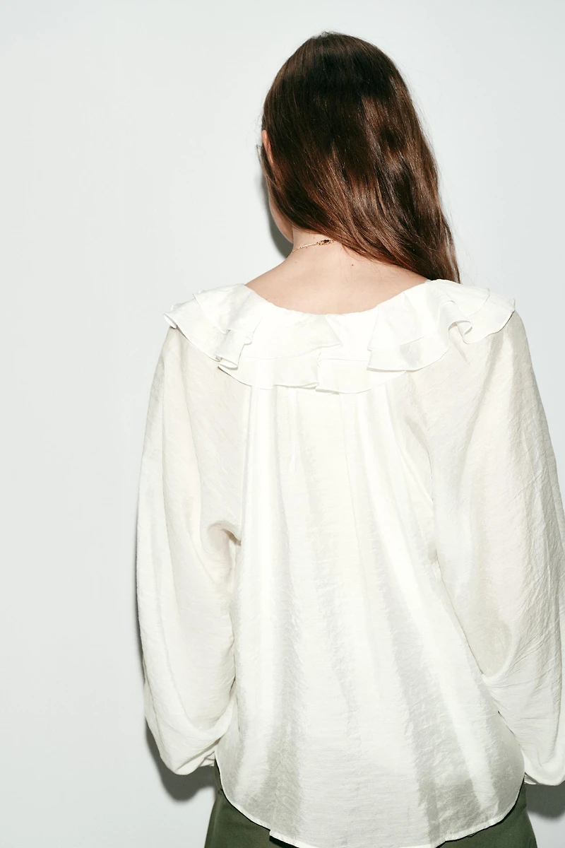 BLOUSE À VOLANTS ET PLIS