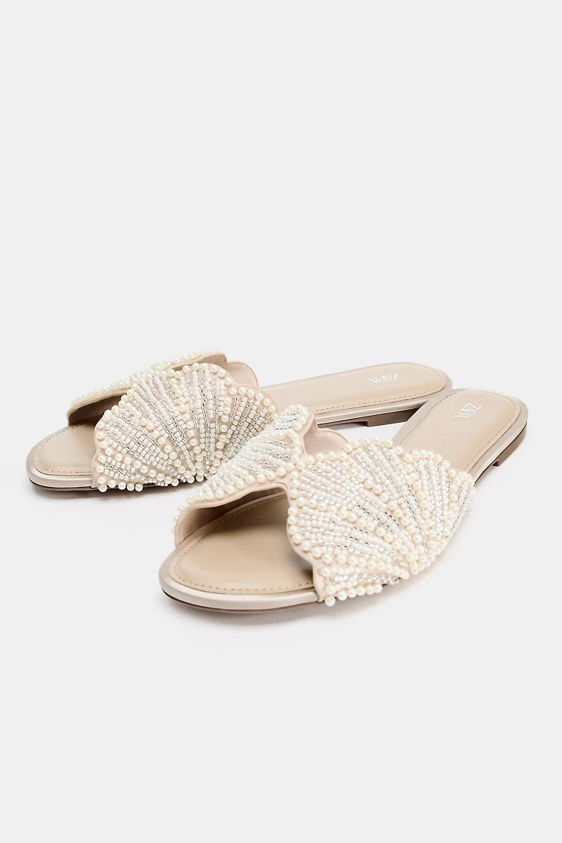 FLAT SANDALS WITH SHINY APPLIQUES