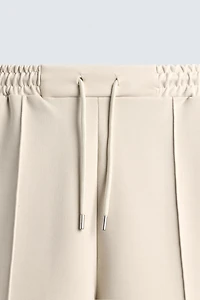 SHORT INTERLOCK ÉTIQUETTE