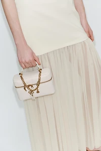 VANITY BAG WITH CHARMS