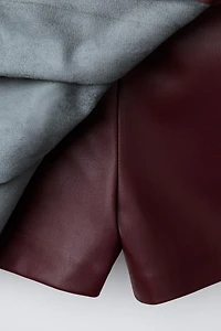 FAUX LEATHER PLEATED SKORT