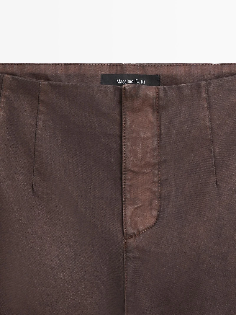Waxed flare fit trousers