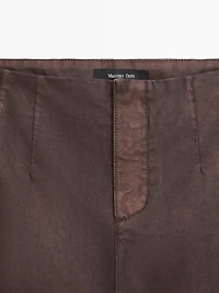 Waxed flare fit trousers