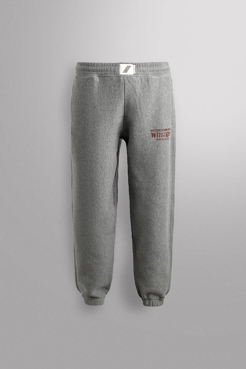 JOGGING PANTS WITH PRINTED TEXT