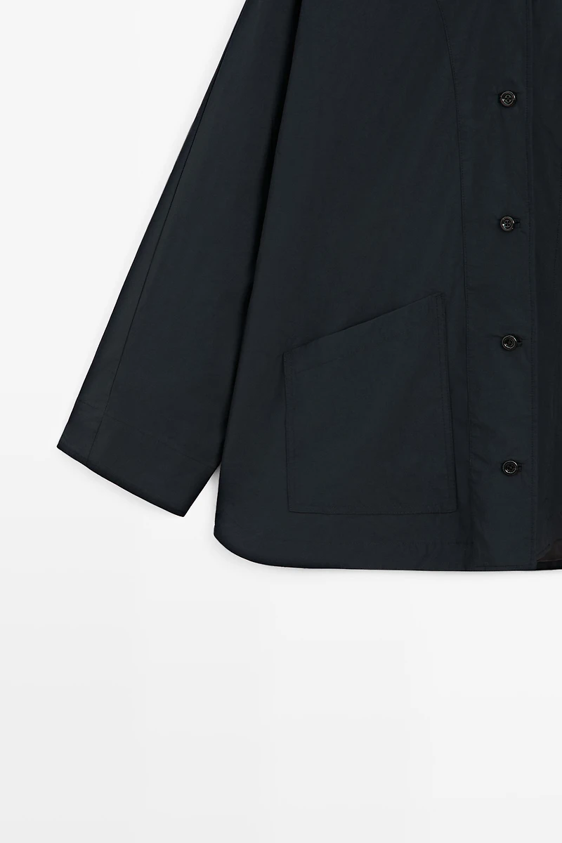 Jacket with buttoned collar strap