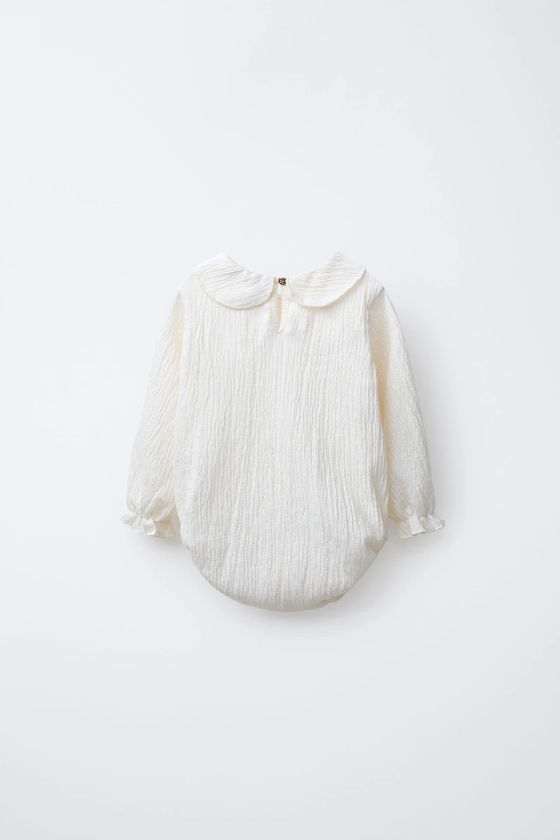 TEXTURED NECK BODYSUIT