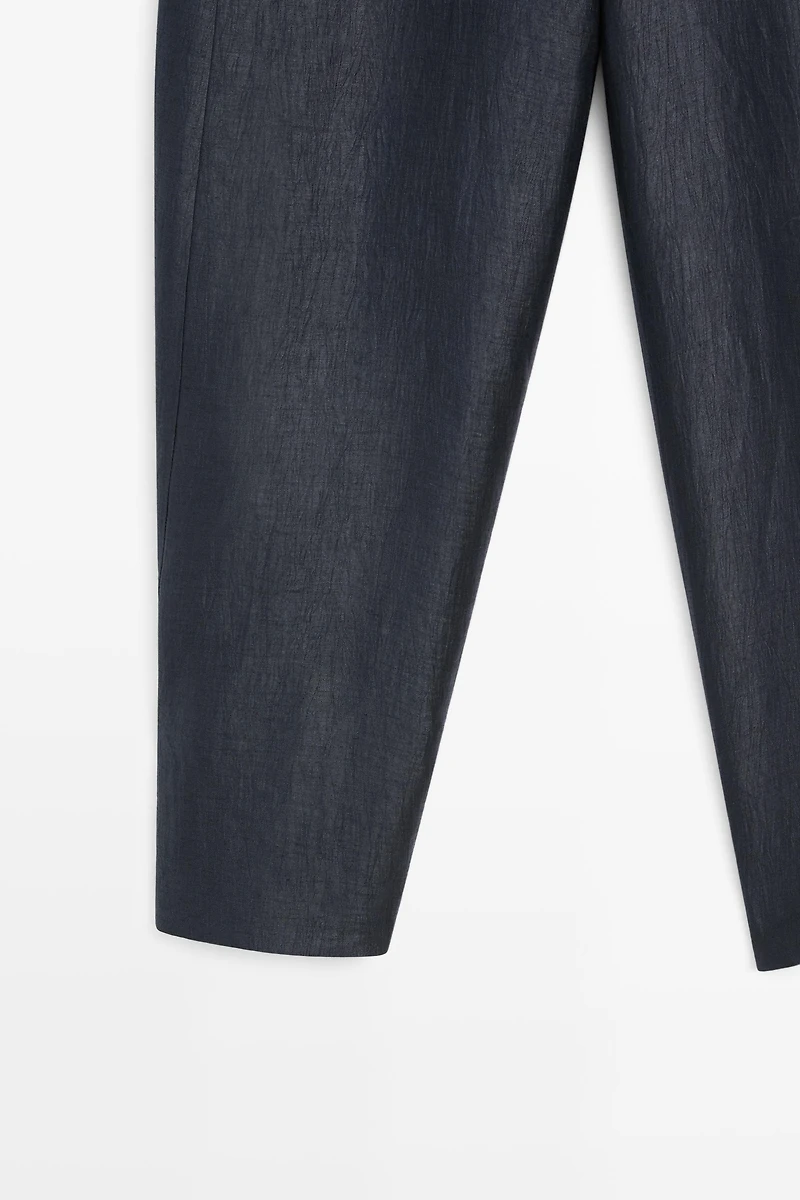 Trousers with gathered hems