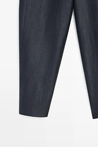 Trousers with gathered hems