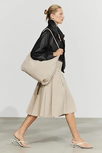 Pleated midi skirt with contrasting sash
