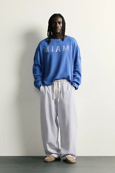 STRIPED WIDE FIT PANTS