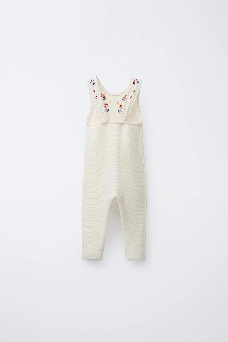 LONG KNIT OVERALLS WITH CROSS-STITCH DETAILS
