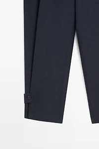 Flowing linen blend pants with buttoned tab detail