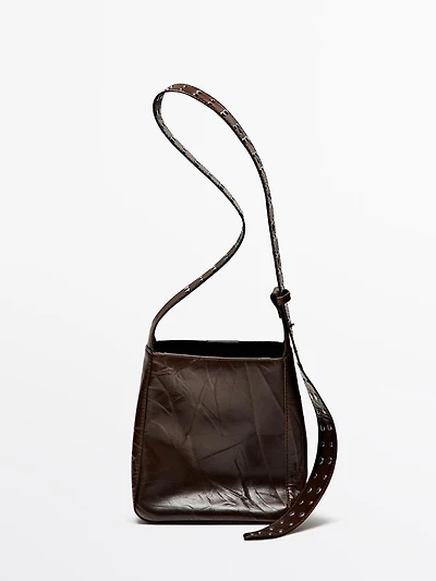 Nappa leather bucket bag with studs