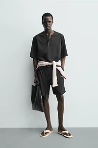 RELAXED FIT PLEATED SHORTS