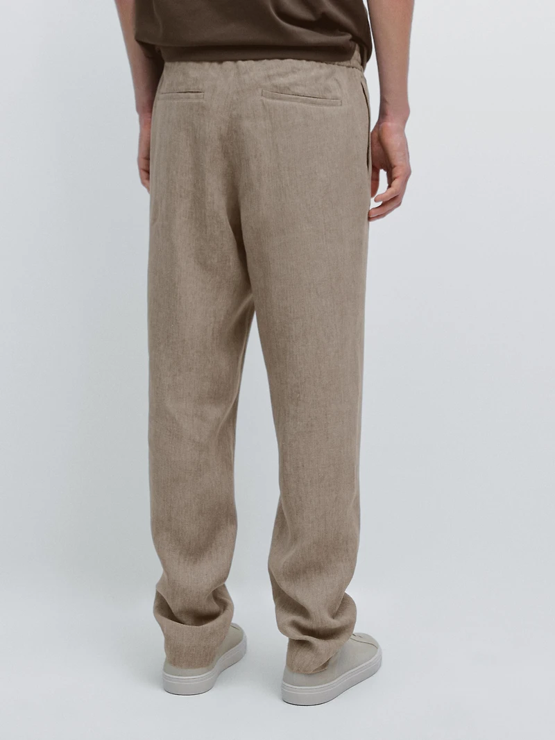Faded total look linen trousers