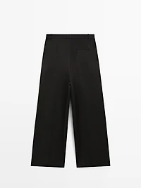 Flowing trousers with pleated details