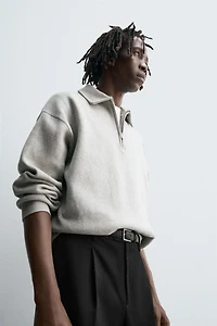 POLO EN MAILLE À COL ZIPPÉ