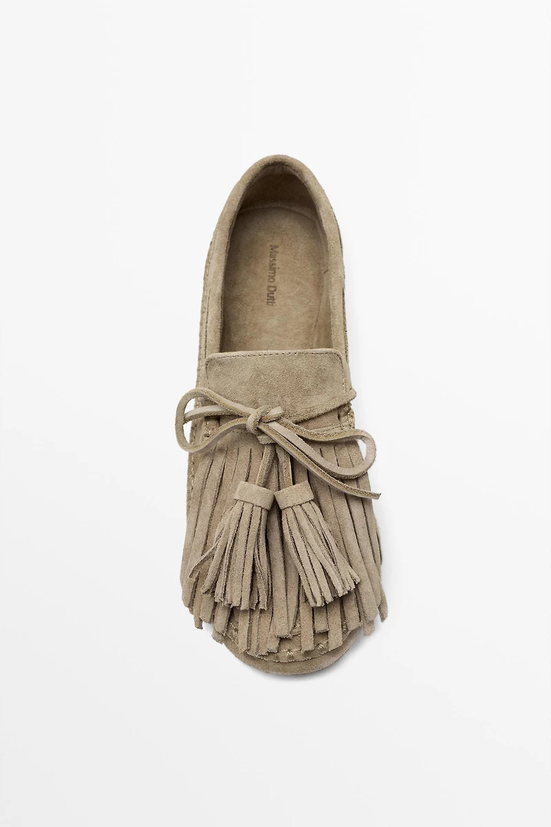 Leather loafers with fringing and tassels