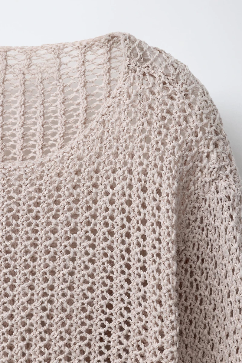 PULL EN MAILLE À FRANGES