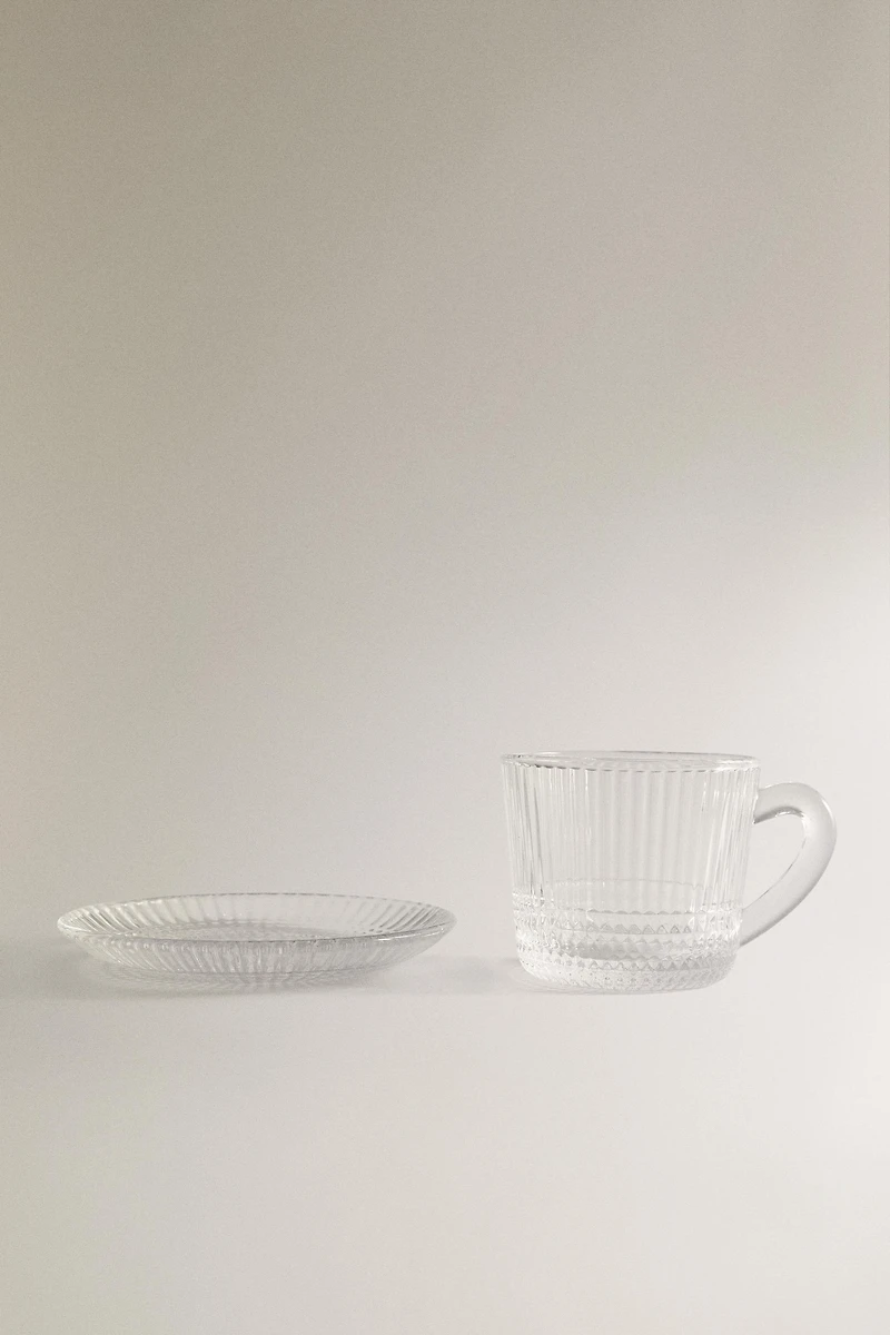 COFFEE CUP AND SAUCER WITH RAISED GEOMETRIC DESIGN