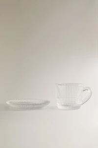 COFFEE CUP AND SAUCER WITH RAISED GEOMETRIC DESIGN