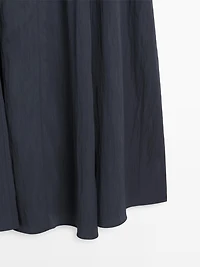 Flowing midi dress with buckles