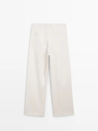 Pleated trousers with crossover fastening - STUDIO