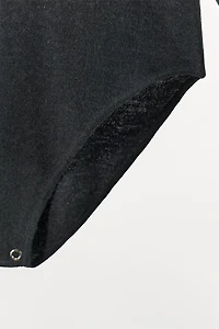 SHOULDER PAD KNIT BODYSUIT