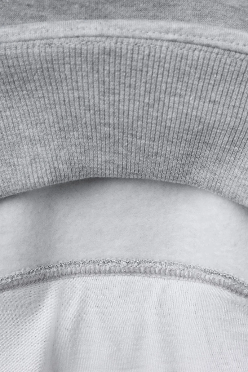 VARSITY DOUBLE HEM HOODED SWEATSHIRT