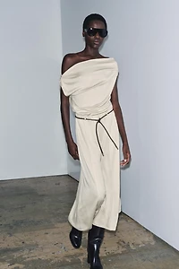 TOP ASYMÉTRIQUE EN MAILLE COUPÉE