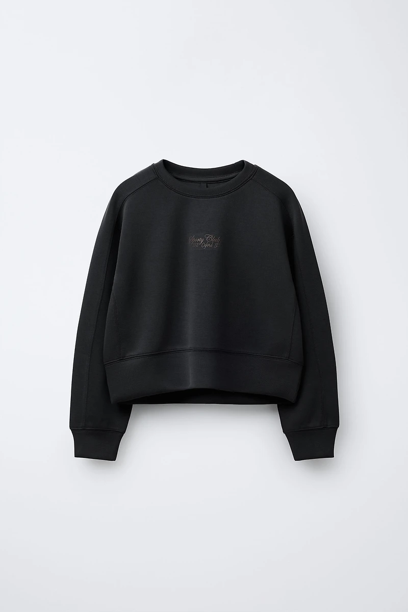 RAISED TEXT SWEATSHIRT